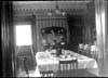 Dining Room in the Charles Draper house with table set for dinner