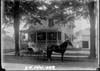 Mrs. Harry Robinson and friend in front of Robinson residence on Penniman Avenue