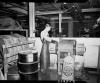 Worker in apron using Roto-Finish at Shakespeare Company