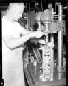 Man working a drill press