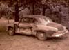 Damaged two door Chevrolet Sedan