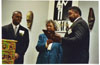 Taken at the UAW Local 602 Union Hall during the annual Taste of Black History program (year unknown).  The persons in the photo are, from left to right: Michael Fleming, Mrs. Pressley, Johnny Anthony.  