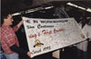 Launch of the J-Car (Cavalier and Sunbird) during which the employees signed the banner commemorating the event.  Subjects are, from left to right: Tim Root, Eddies Gentry.