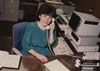 Barb Rossi at her desk outside the plant manager's office at Fisher. Given the age of the IBM computer it is likely early 1980s.