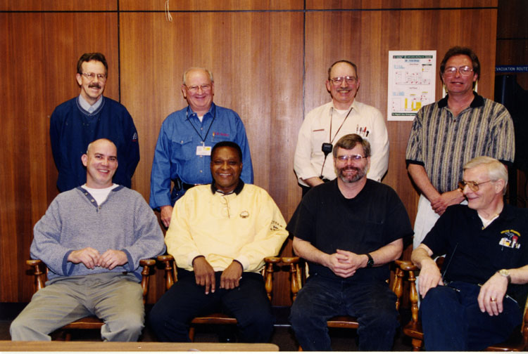 image of Subjects in the back row are, from left to right: Ed Grant, JD Dewitt, Unknown, Unknown.  Front row left to right: Matt Strickling, Unknown, Unknown, Unknown.